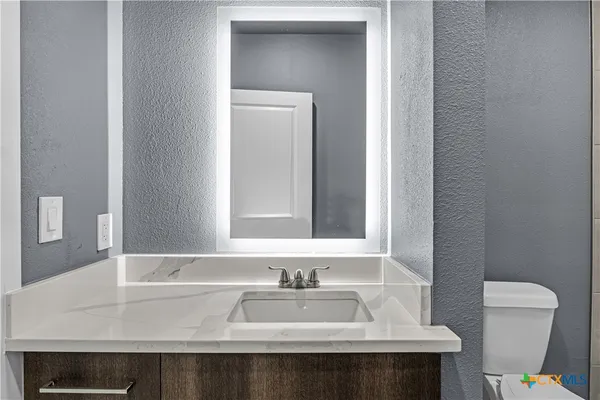 a bathroom with a sink and a toilet