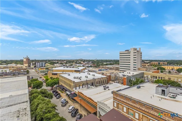 a view of a building and a street