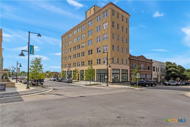 a view of a city with tall buildings