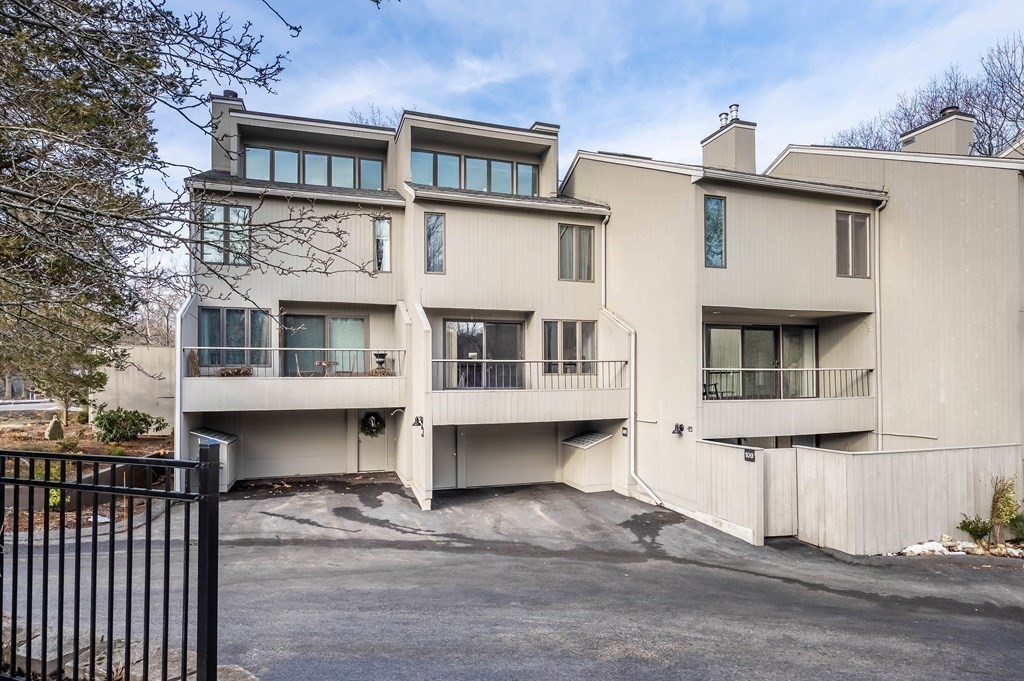 101 Mill Pond, Unit 101 North Andover, MA 01845 - Photo 1 of 27 a front view of a house with a balcony