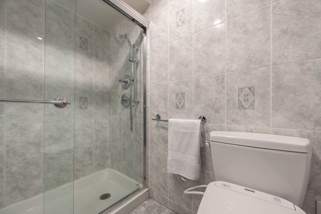 101 Mill Pond, Unit 101 North Andover, MA 01845 - Photo 17 of 27 a bathroom with a shower and a toilet