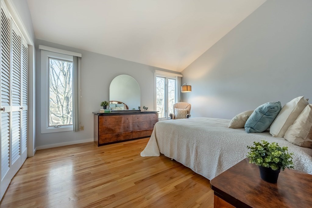 101 Mill Pond, Unit 101 North Andover, MA 01845 - Photo 18 of 27 a living room with a bed furniture and a window