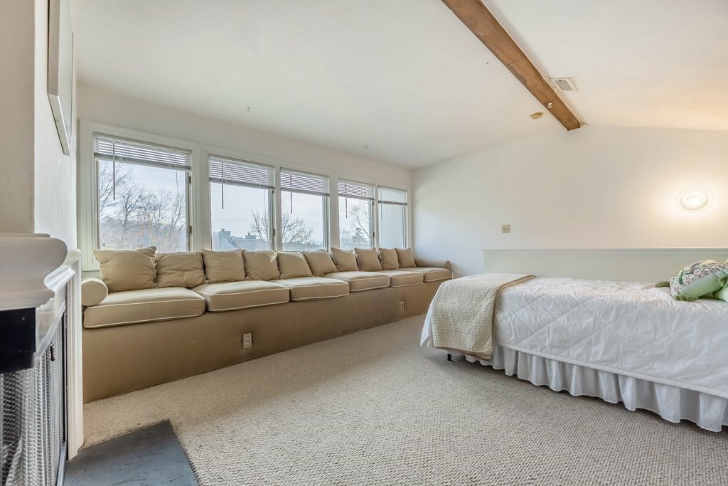 101 Mill Pond, Unit 101 North Andover, MA 01845 - Photo 21 of 27 a bedroom with bed and a couch
