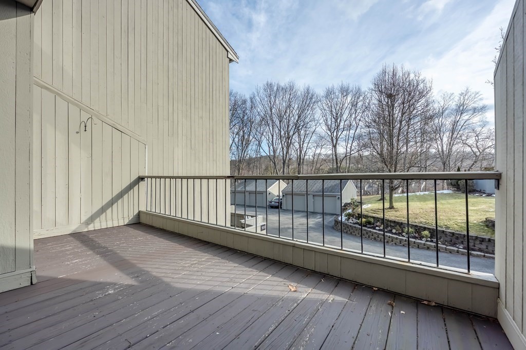 101 Mill Pond, Unit 101 North Andover, MA 01845 - Photo 23 of 27 a view of a balcony with wooden floor
