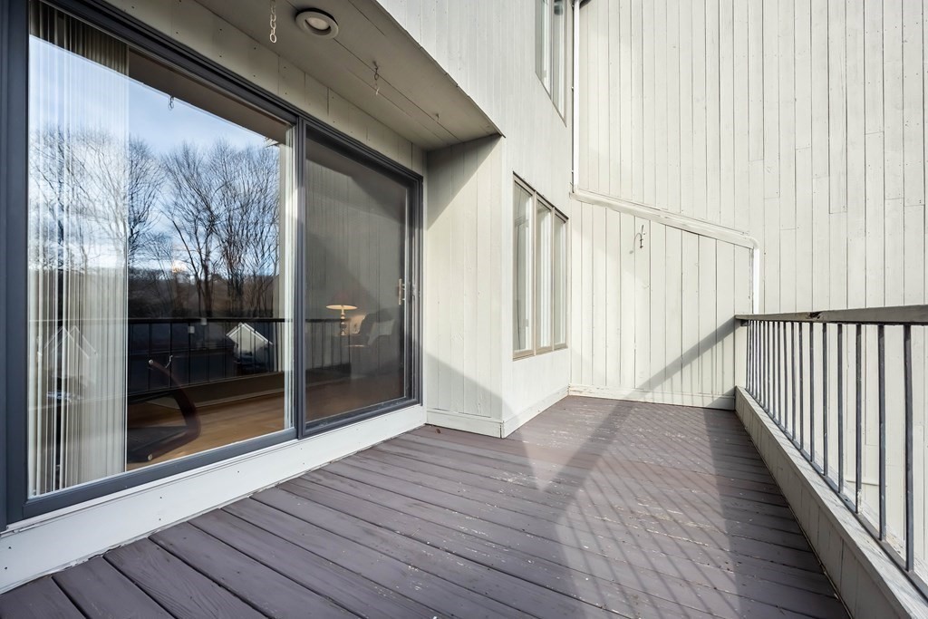 101 Mill Pond, Unit 101 North Andover, MA 01845 - Photo 24 of 27 a view of a porch with wooden floor and outdoor space