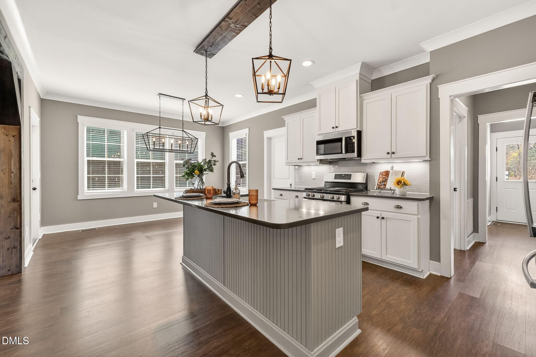 325 Old Stancil Road Kenly, NC 27542 - Photo 14 of 54 a kitchen with granite countertop a stove top oven a sink a counter space and cabinets