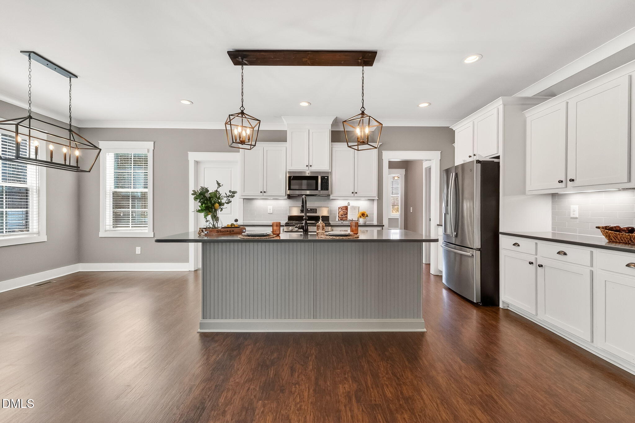 325 Old Stancil Road Kenly, NC 27542 - Photo 18 of 54 a kitchen with stainless steel appliances granite countertop a refrigerator a sink dishwasher a stove and white cabinets with wooden floor