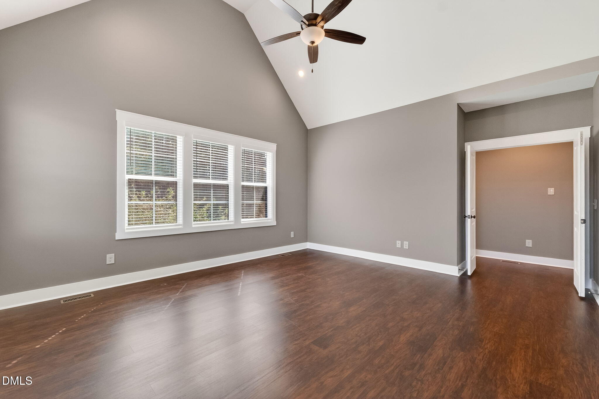 325 Old Stancil Road Kenly, NC 27542 - Photo 22 of 54 a view of an empty room with wooden floor and a window