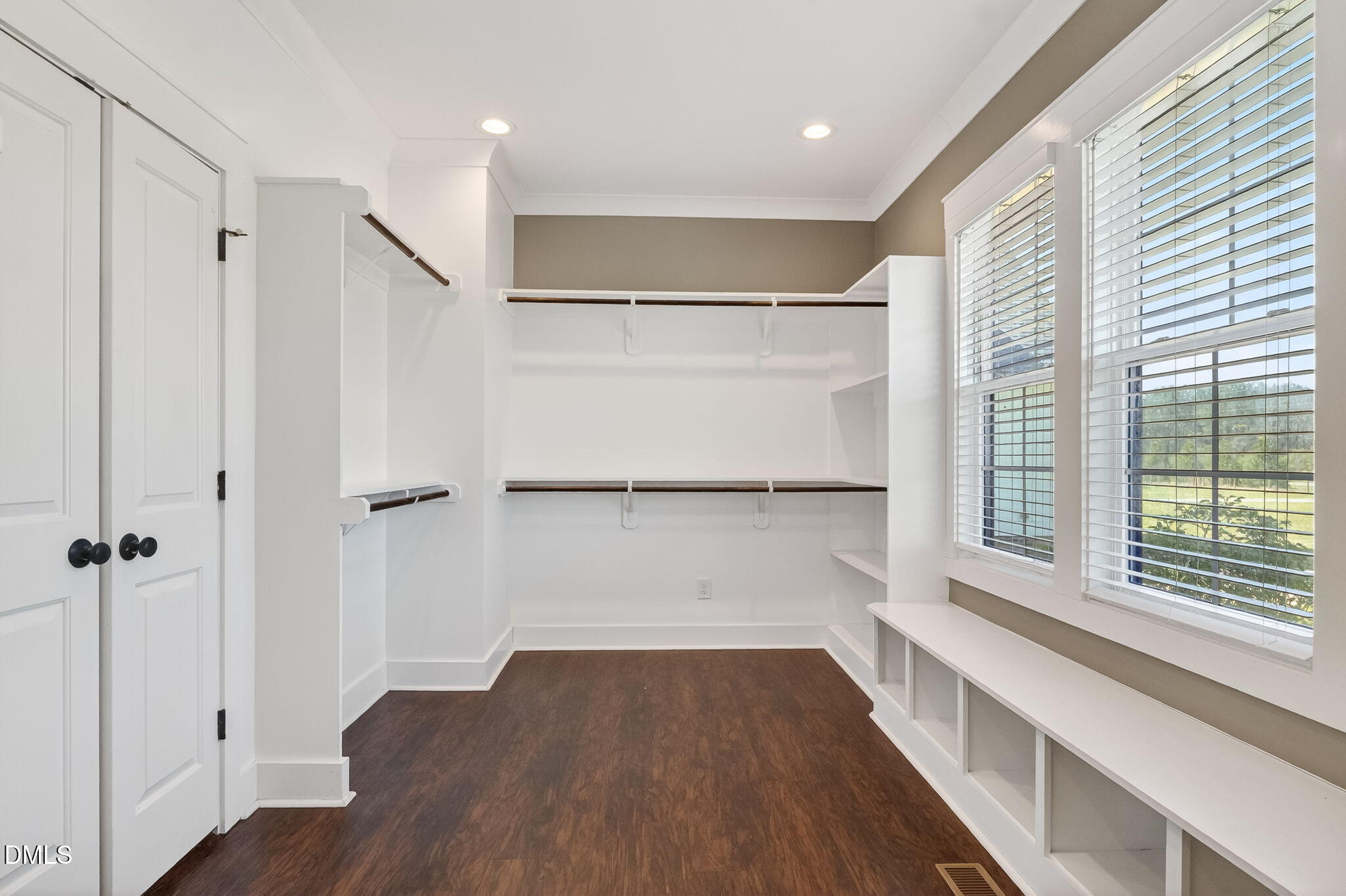 325 Old Stancil Road Kenly, NC 27542 - Photo 27 of 54 a view of walk in closet with wooden floor and a window