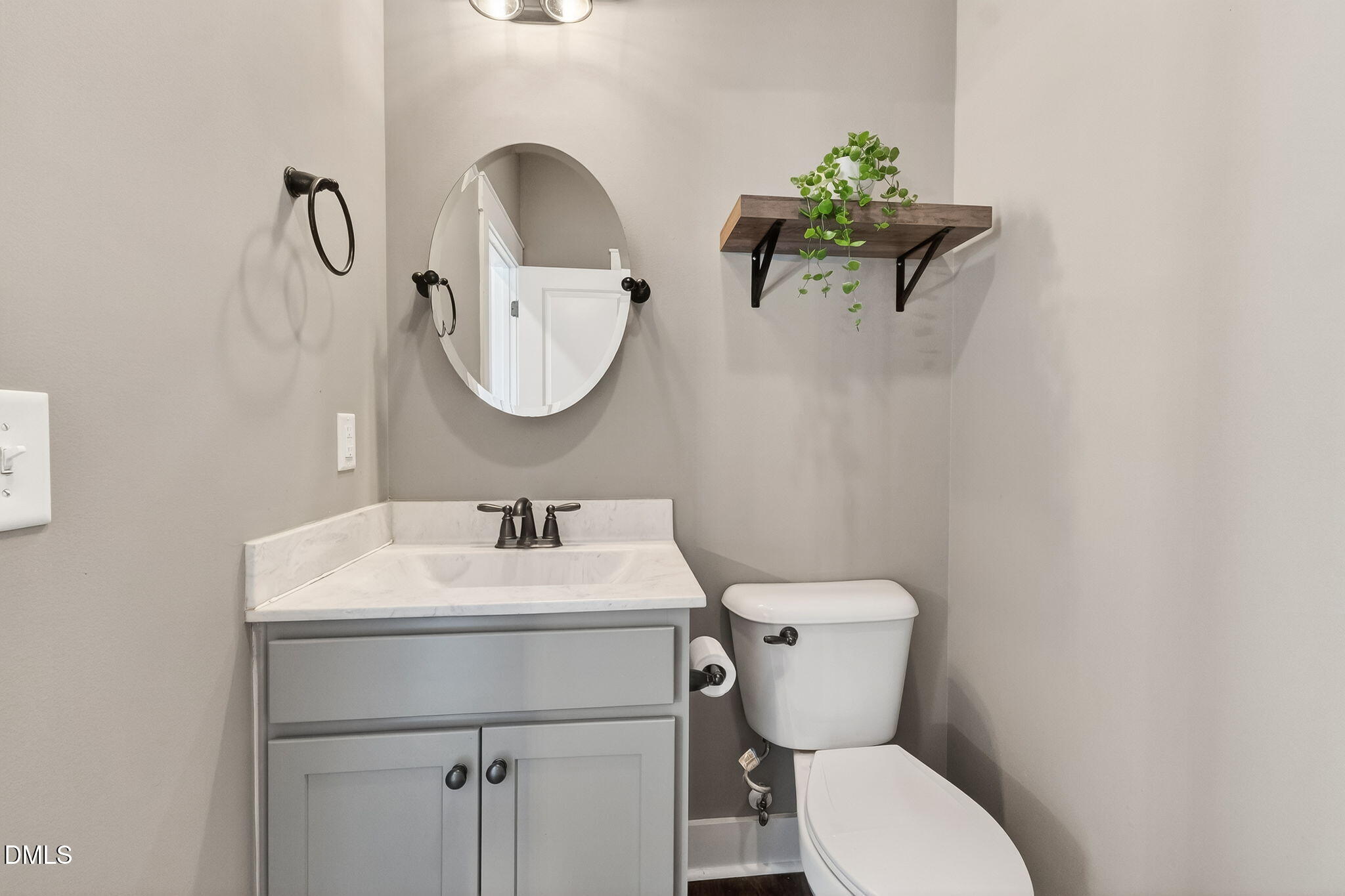325 Old Stancil Road Kenly, NC 27542 - Photo 28 of 54 a bathroom with a toilet sink and mirror