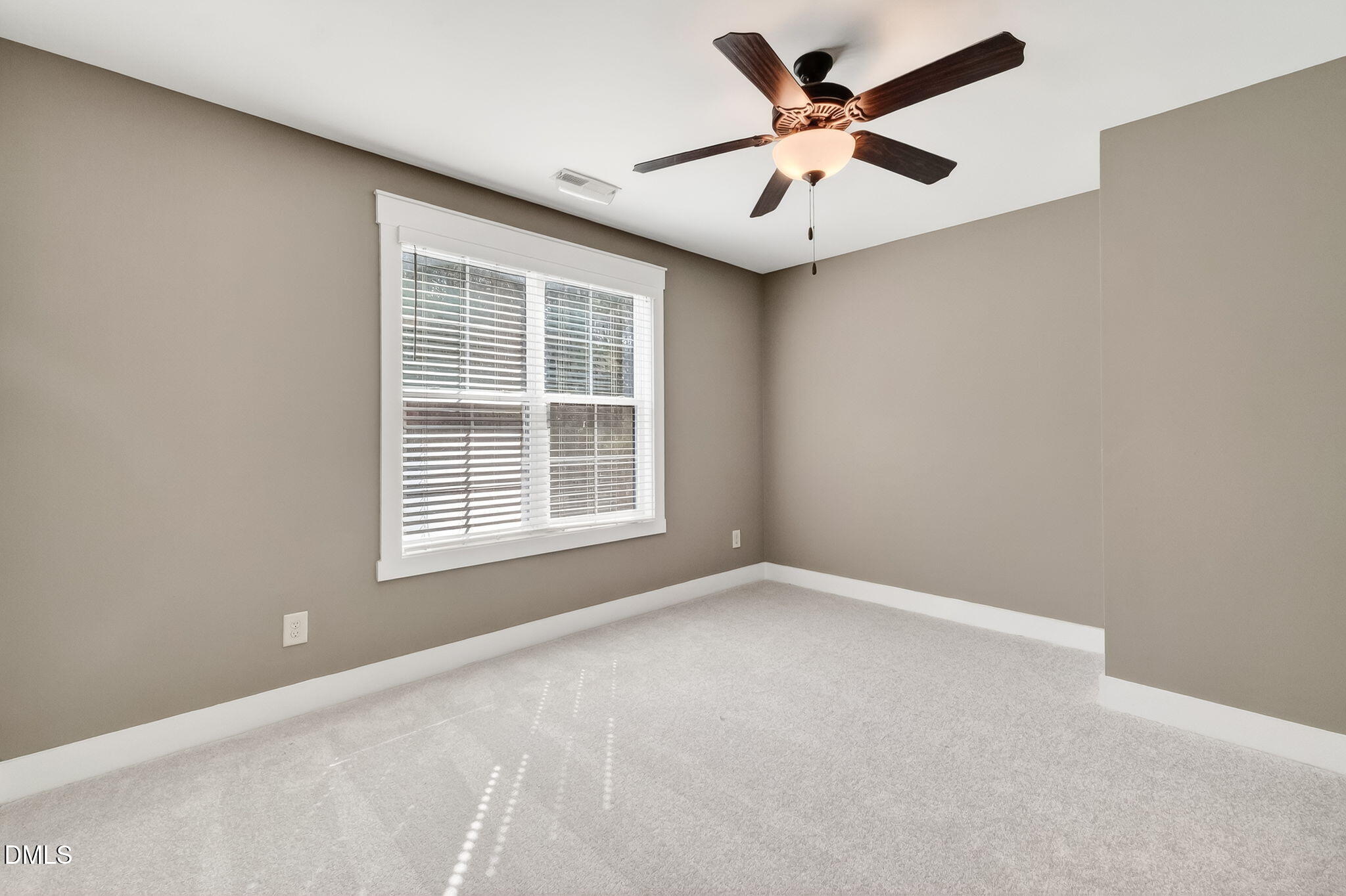 325 Old Stancil Road Kenly, NC 27542 - Photo 31 of 54 an empty room with ceiling fan and window