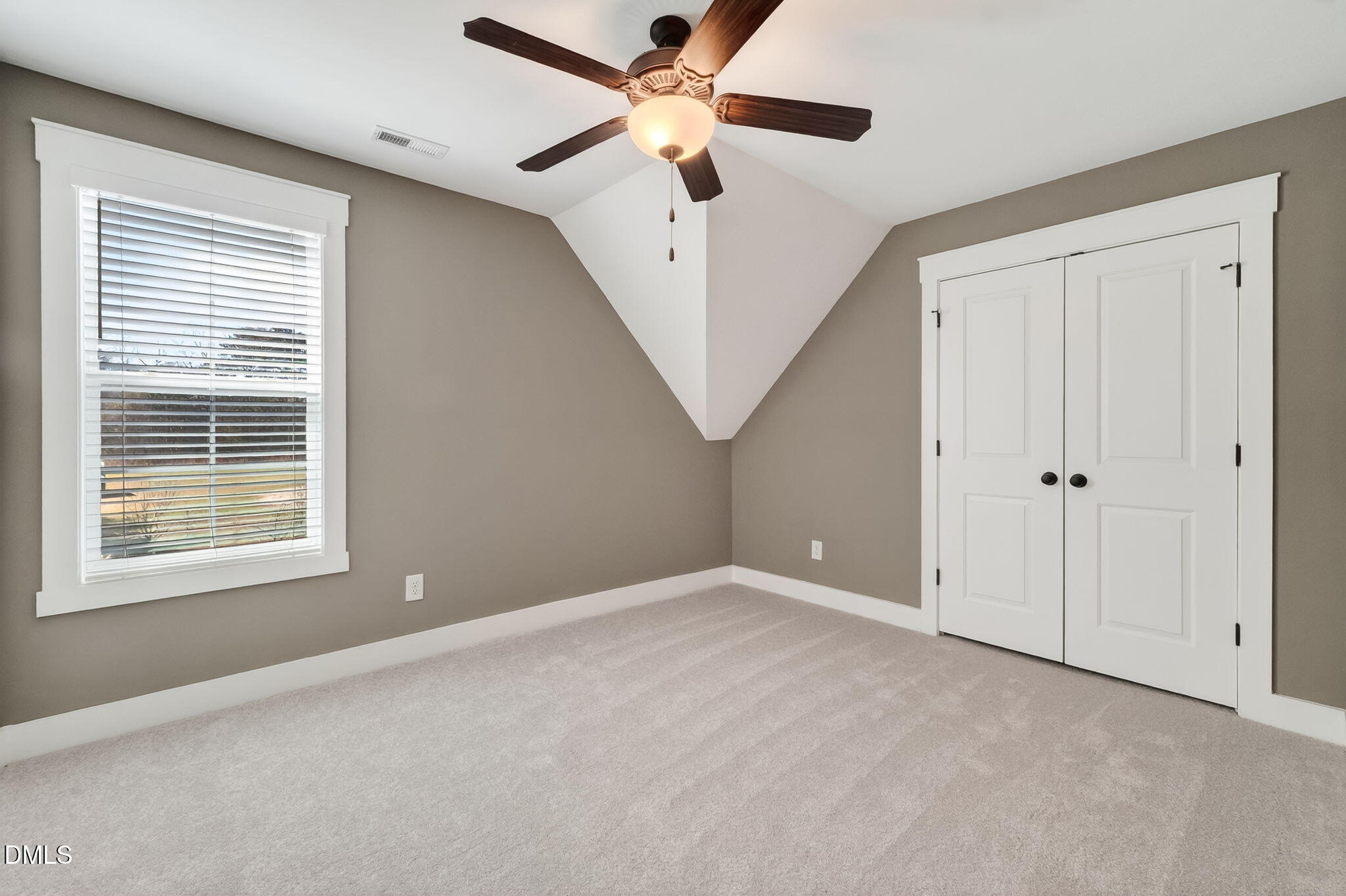 325 Old Stancil Road Kenly, NC 27542 - Photo 37 of 54 a view of an empty room with a window and a ceiling fan
