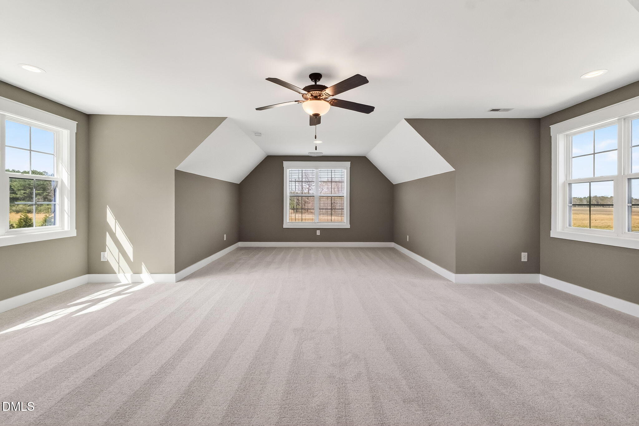 325 Old Stancil Road Kenly, NC 27542 - Photo 40 of 54 a view of a big room with windows and chandelier fan