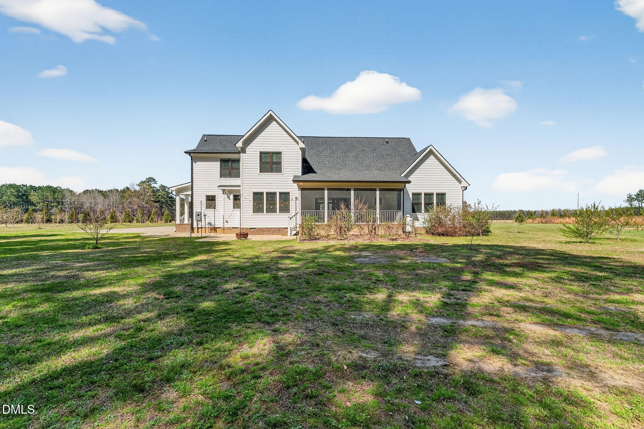 325 Old Stancil Road Kenly, NC 27542 - Photo 47 of 54 a front view of a house with a yard table and chairs