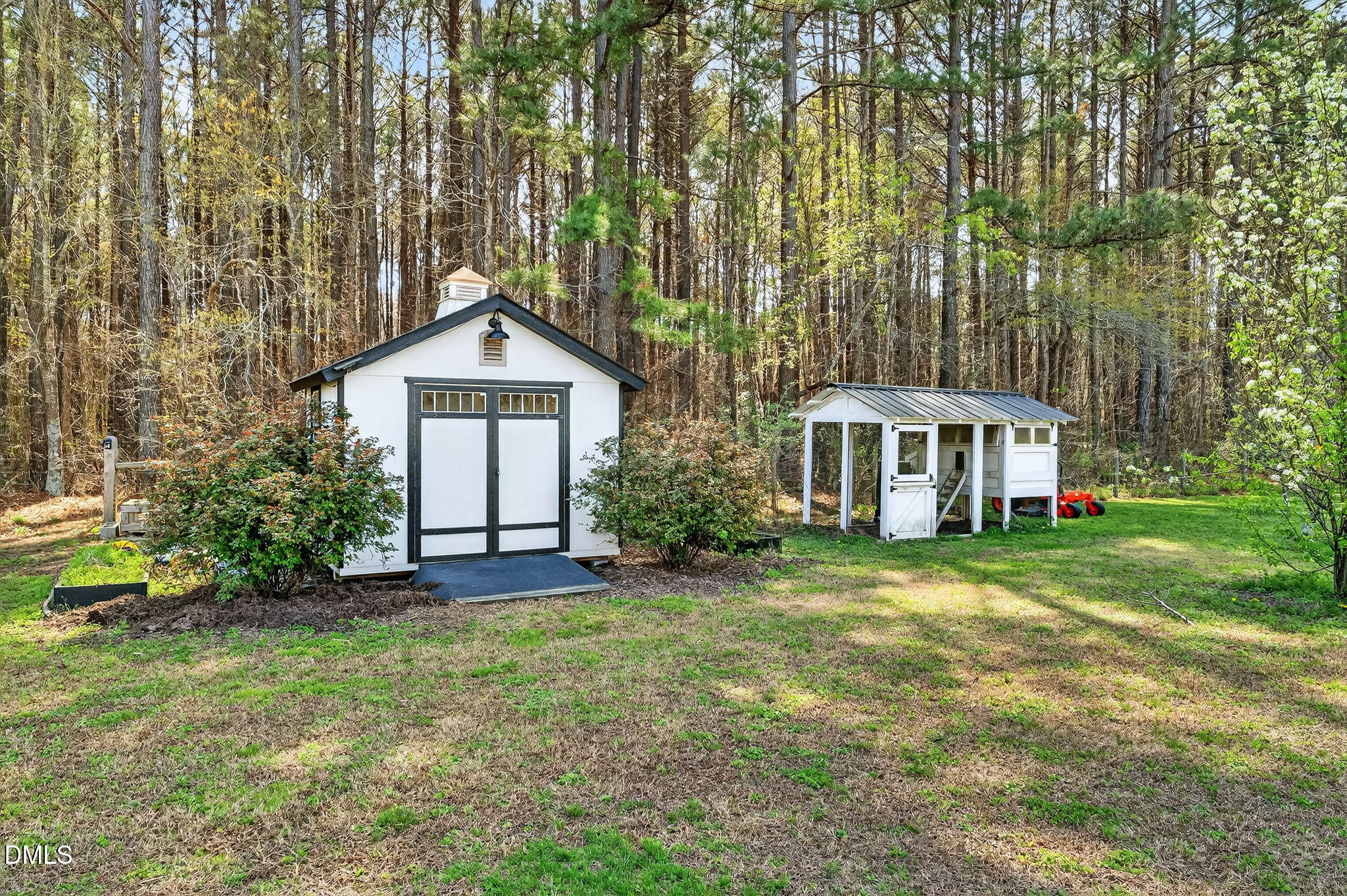 325 Old Stancil Road Kenly, NC 27542 - Photo 49 of 54 a front view of a house with a garden
