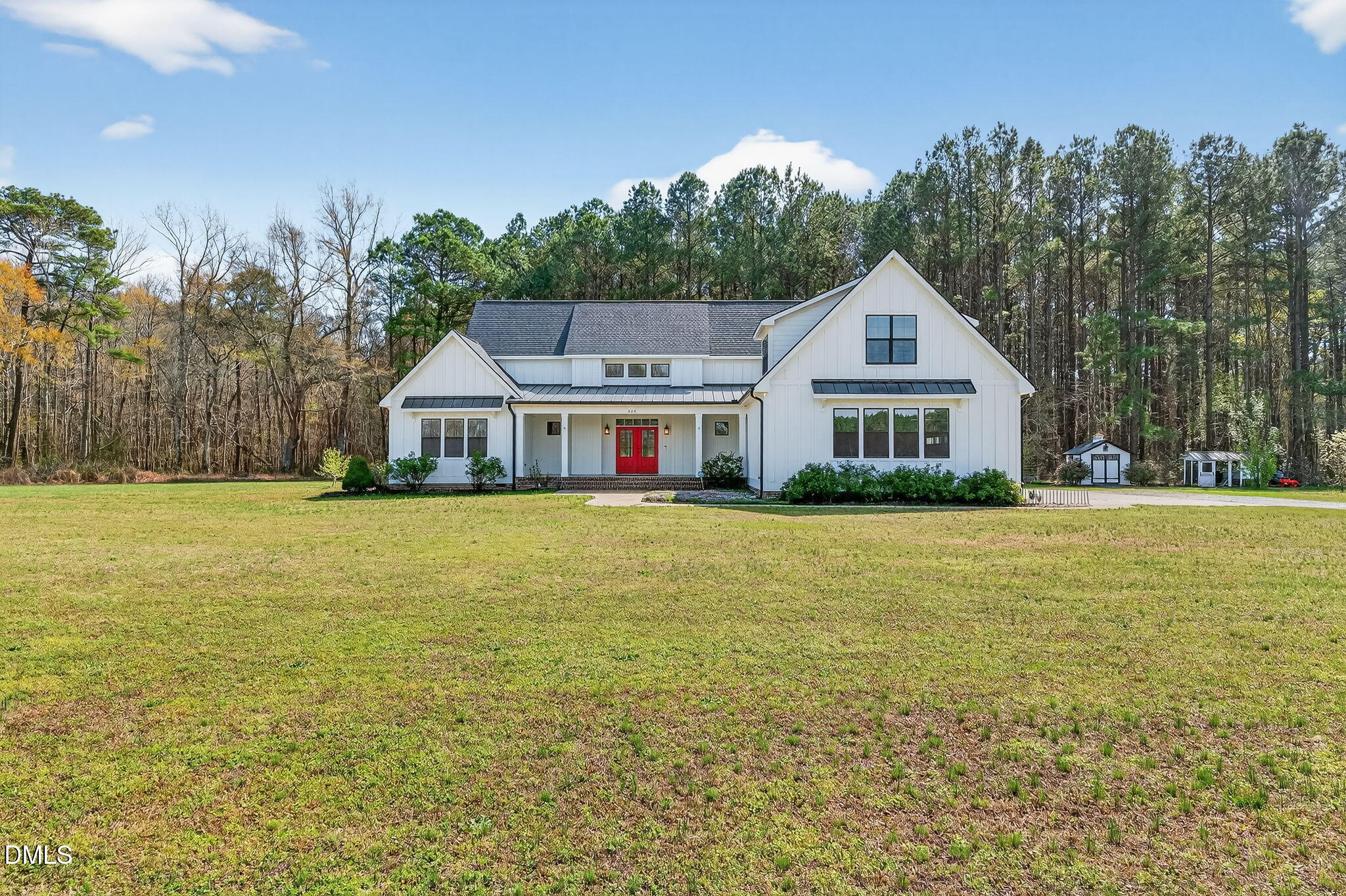 325 Old Stancil Road Kenly, NC 27542 - Photo 54 of 54 a front view of house with yard and trees in the background