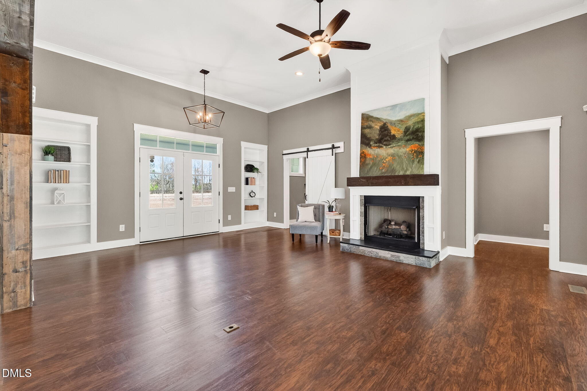 325 Old Stancil Road Kenly, NC 27542 - Photo 7 of 54 a view of a livingroom with wooden floor a fireplace and window