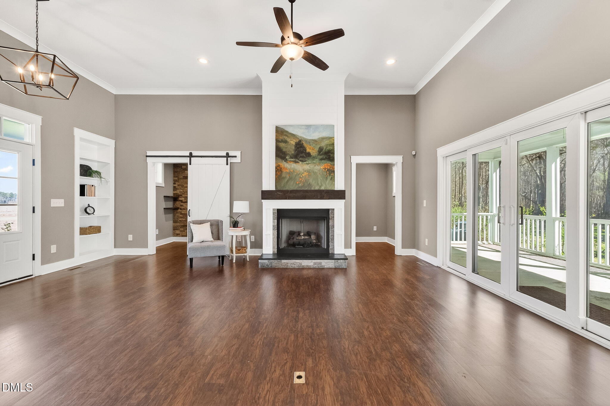 325 Old Stancil Road Kenly, NC 27542 - Photo 9 of 54 a view of an empty room with wooden floor and a fireplace