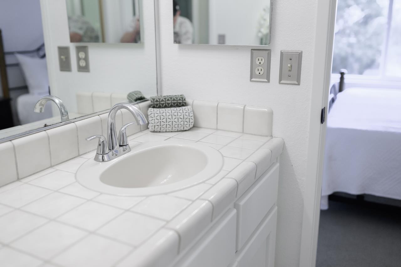 132 Arabian Way Scotts Valley, CA 95066 - Photo 44 of 82 a bathroom with a sink and a mirror