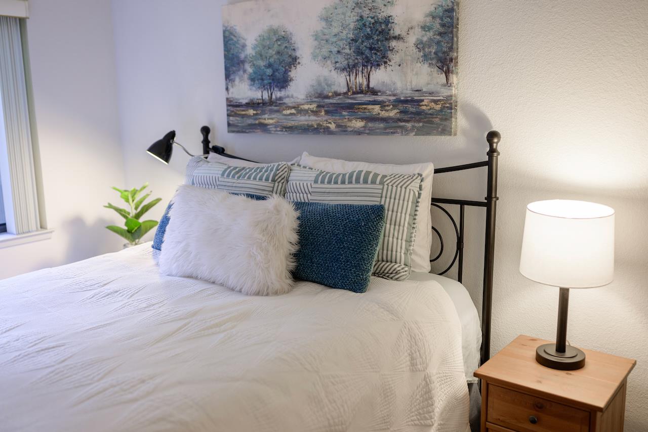 132 Arabian Way Scotts Valley, CA 95066 - Photo 51 of 82 a bedroom with a bed and chandelier