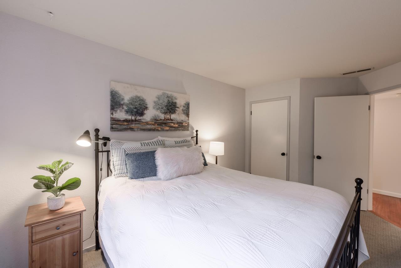 132 Arabian Way Scotts Valley, CA 95066 - Photo 53 of 82 a bedroom with a bed and a potted plant