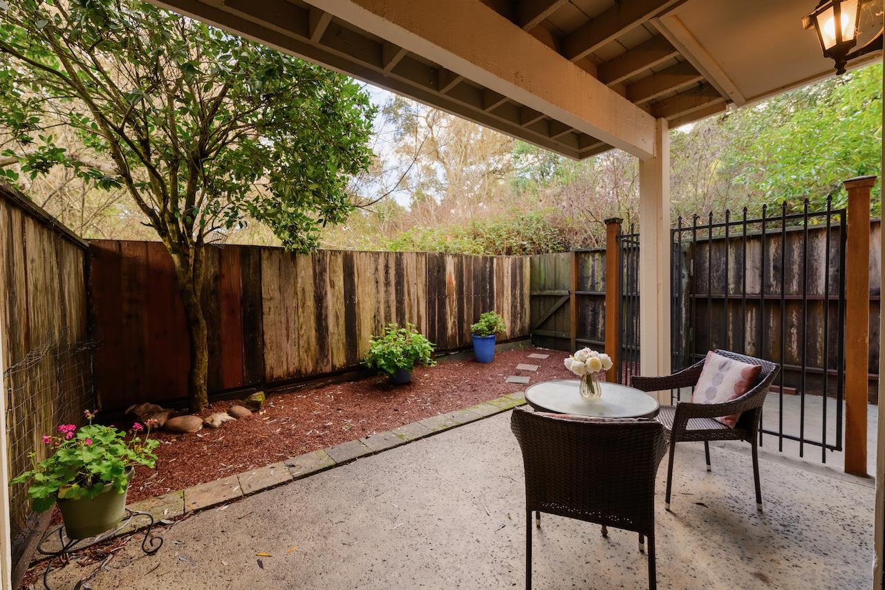 132 Arabian Way Scotts Valley, CA 95066 - Photo 59 of 82 a view of a patio with a dining table and chairs and potted plants