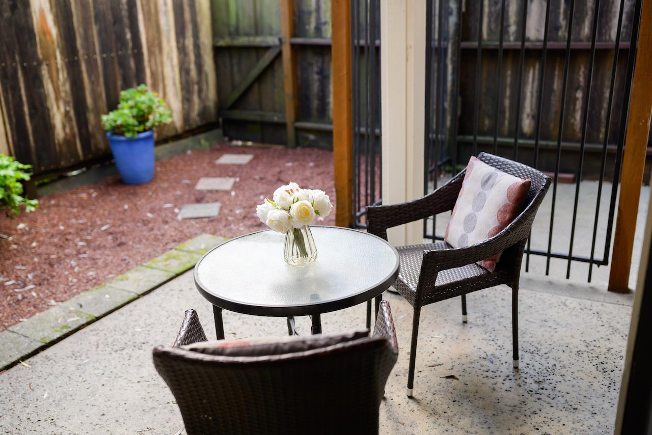 132 Arabian Way Scotts Valley, CA 95066 - Photo 60 of 82 a view of a chairs and table in the patio