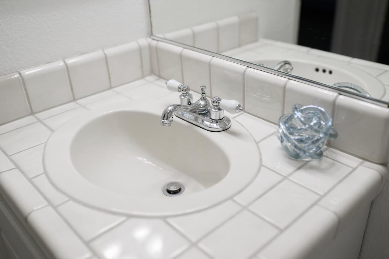 132 Arabian Way Scotts Valley, CA 95066 - Photo 66 of 82 a bathroom with a sink and a mirror
