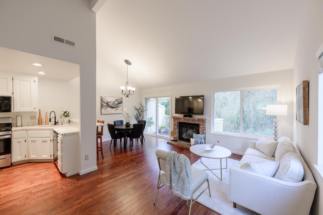 132 Arabian Way Scotts Valley, CA 95066 - Photo 10 of 82 a living room with furniture a dining table and a fireplace