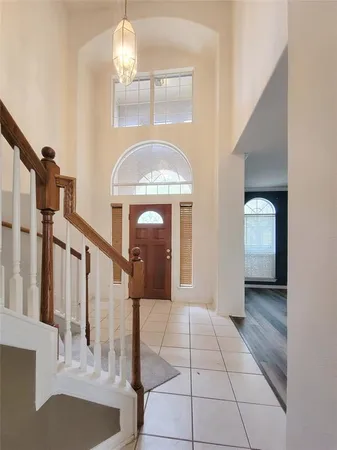 a view of entryway and hall with a front door