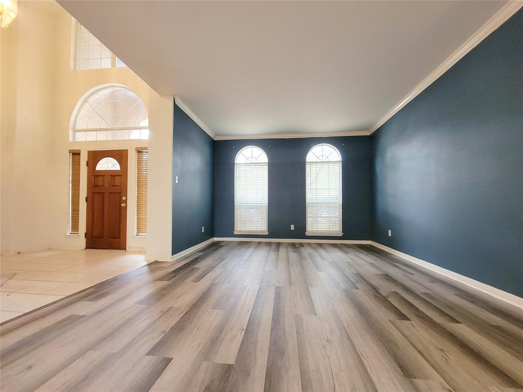 6708 Kilt Court Austin, TX 78754 - Photo 4 of 32 a view of empty room with wooden floor