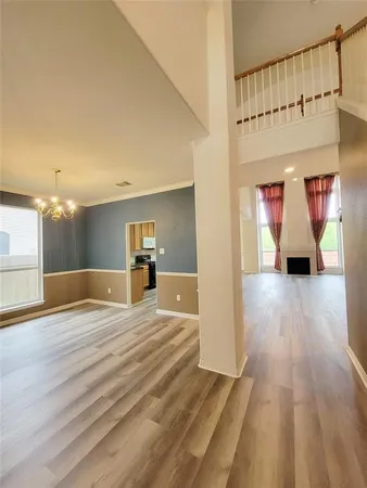 a view of a bedroom from a hallway