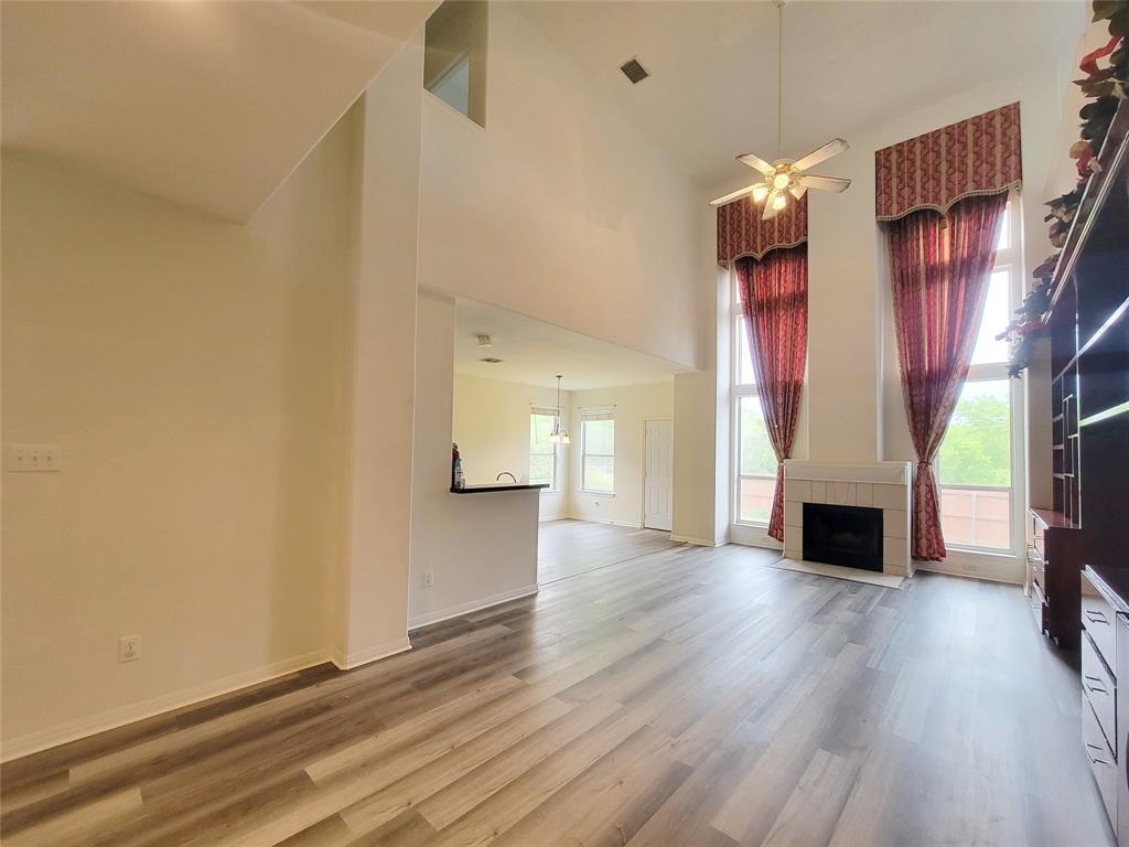 6708 Kilt Court Austin, TX 78754 - Photo 9 of 32 a view of a livingroom with wooden floor fireplace and window