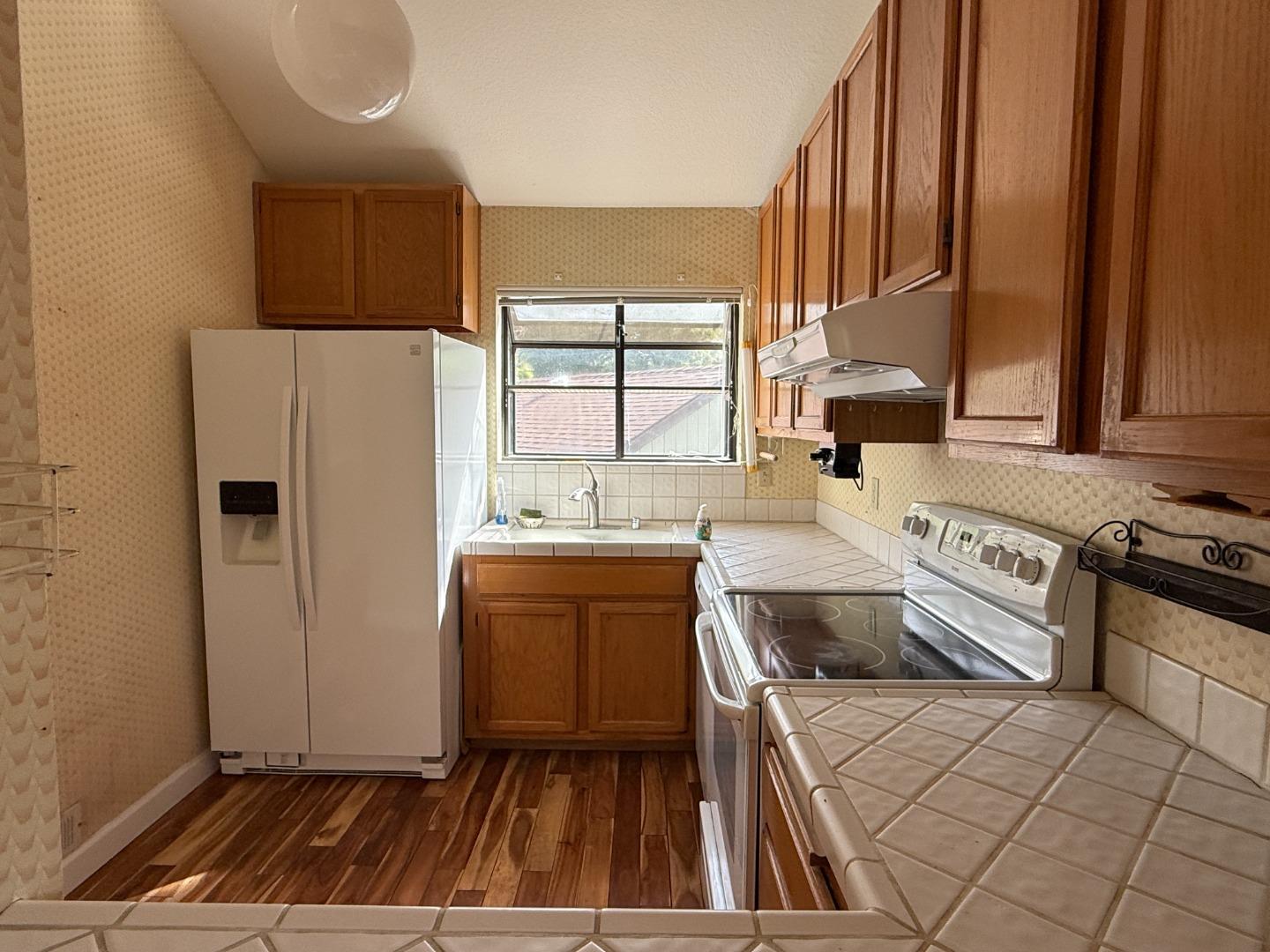 111 Bean Creek Road, Unit 146 Scotts Valley, CA 95066 - Photo 3 of 13 a kitchen with a refrigerator sink and stove