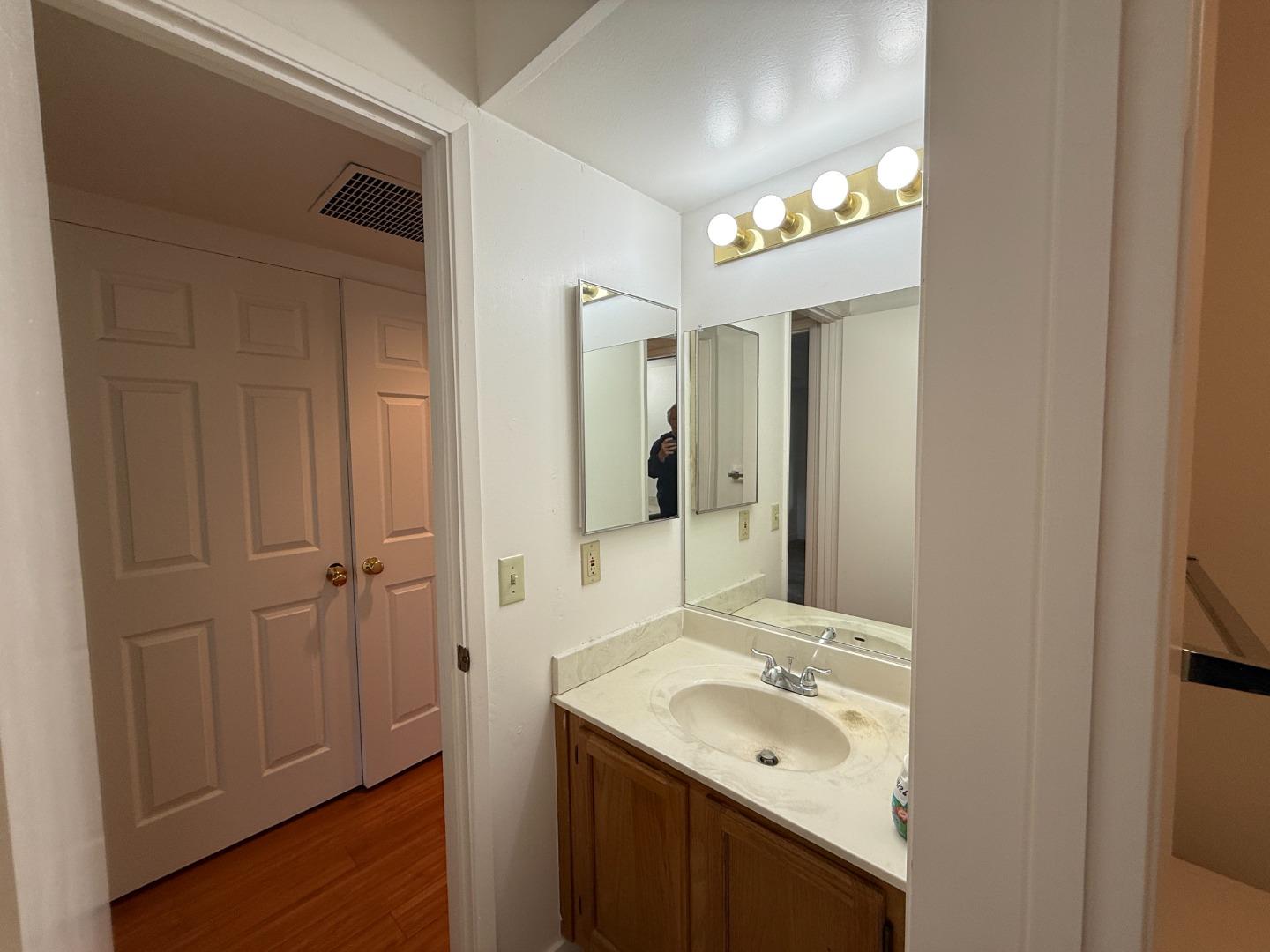 111 Bean Creek Road, Unit 146 Scotts Valley, CA 95066 - Photo 7 of 13 a bathroom with a sink and a mirror