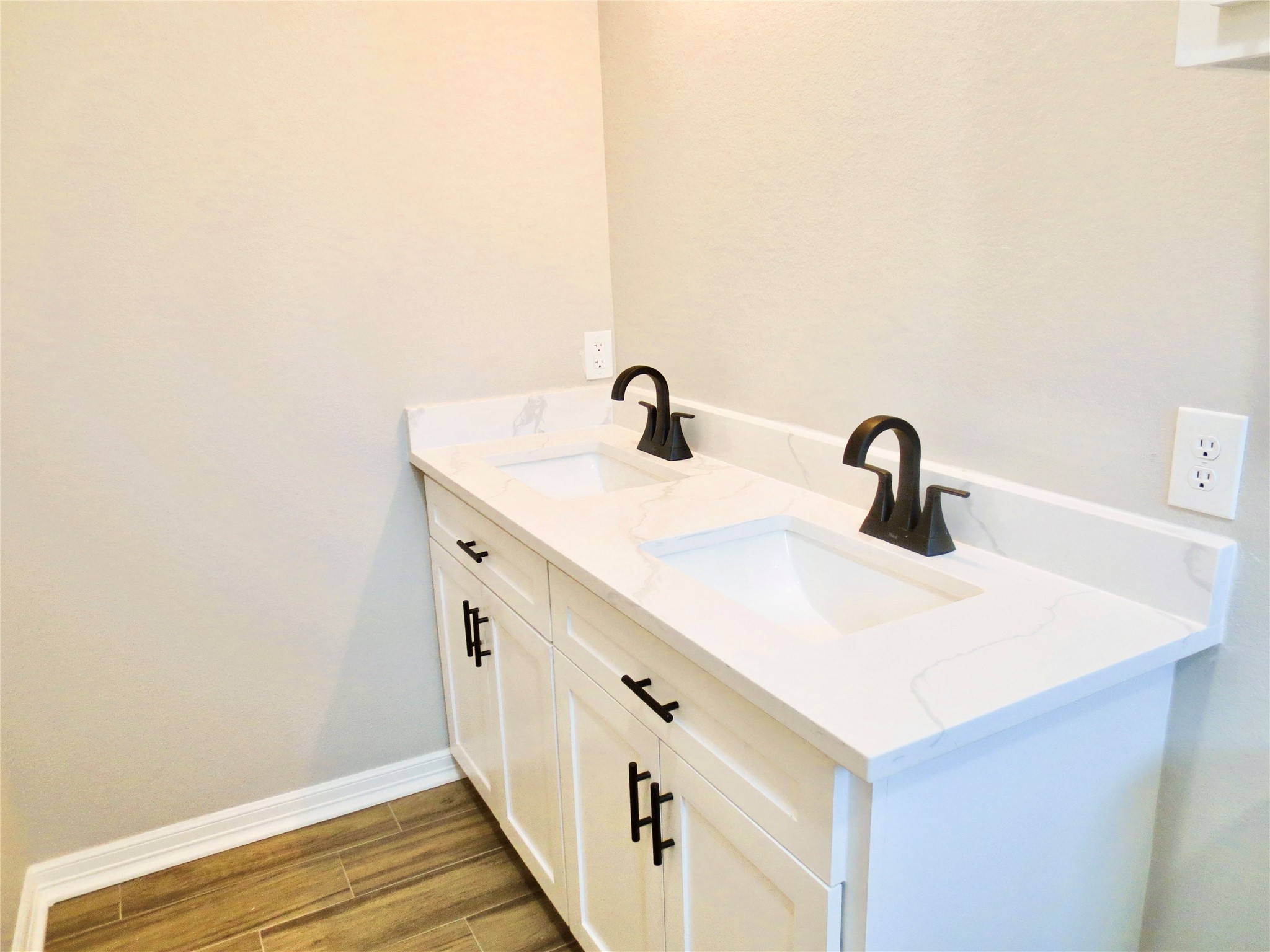 10316 Aldine Westfield Road Houston, TX 77093 - Photo 11 of 13 a bathroom with a double vanity sink and mirror