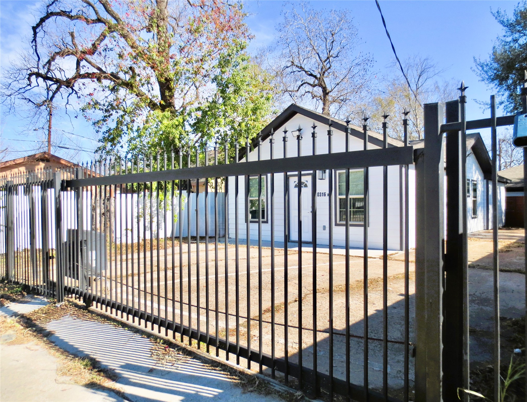 10316 Aldine Westfield Road Houston, TX 77093 - Photo 3 of 13 a view of a black gate