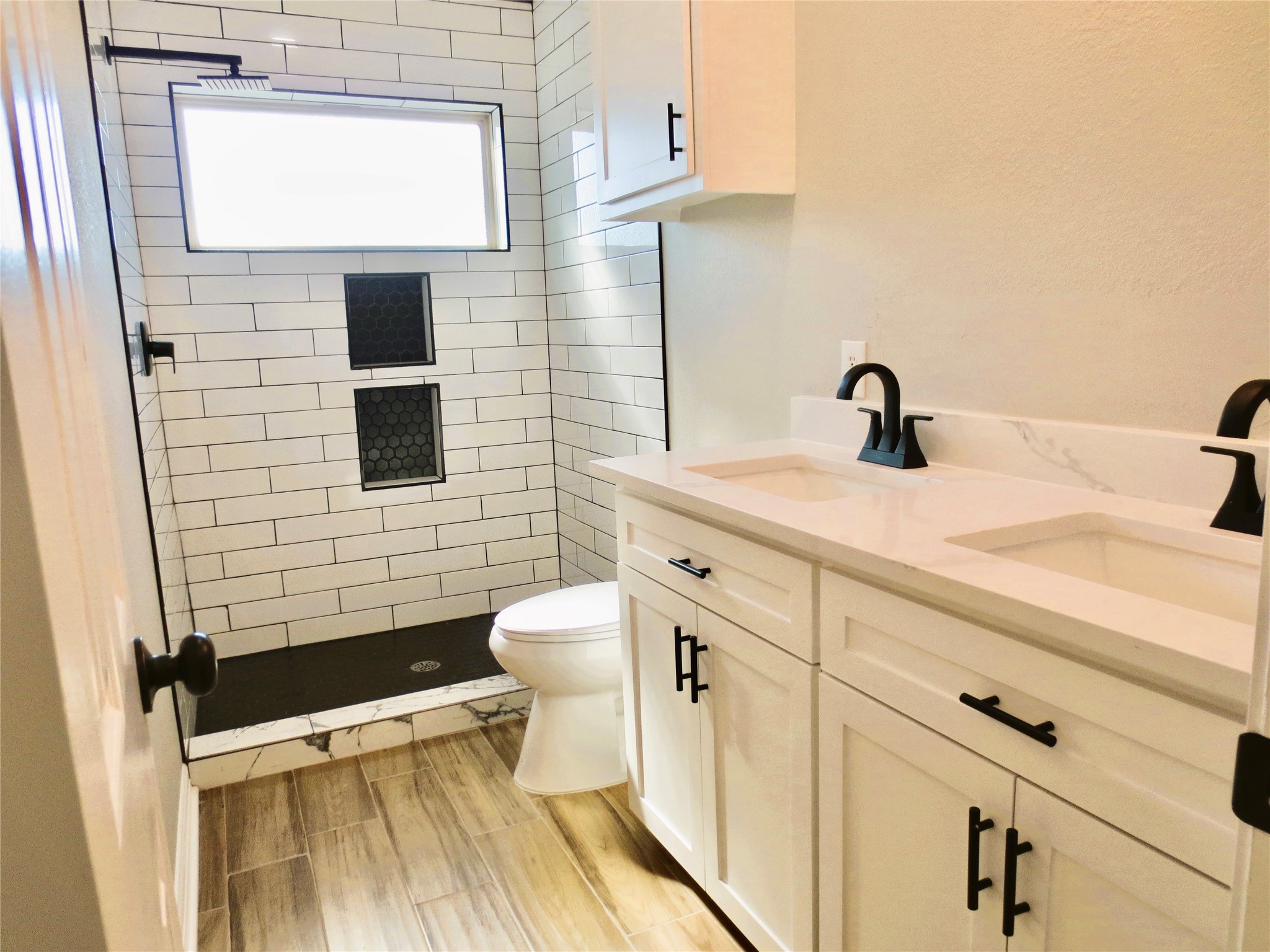 10316 Aldine Westfield Road Houston, TX 77093 - Photo 6 of 13 a bathroom with a sink and a toilet
