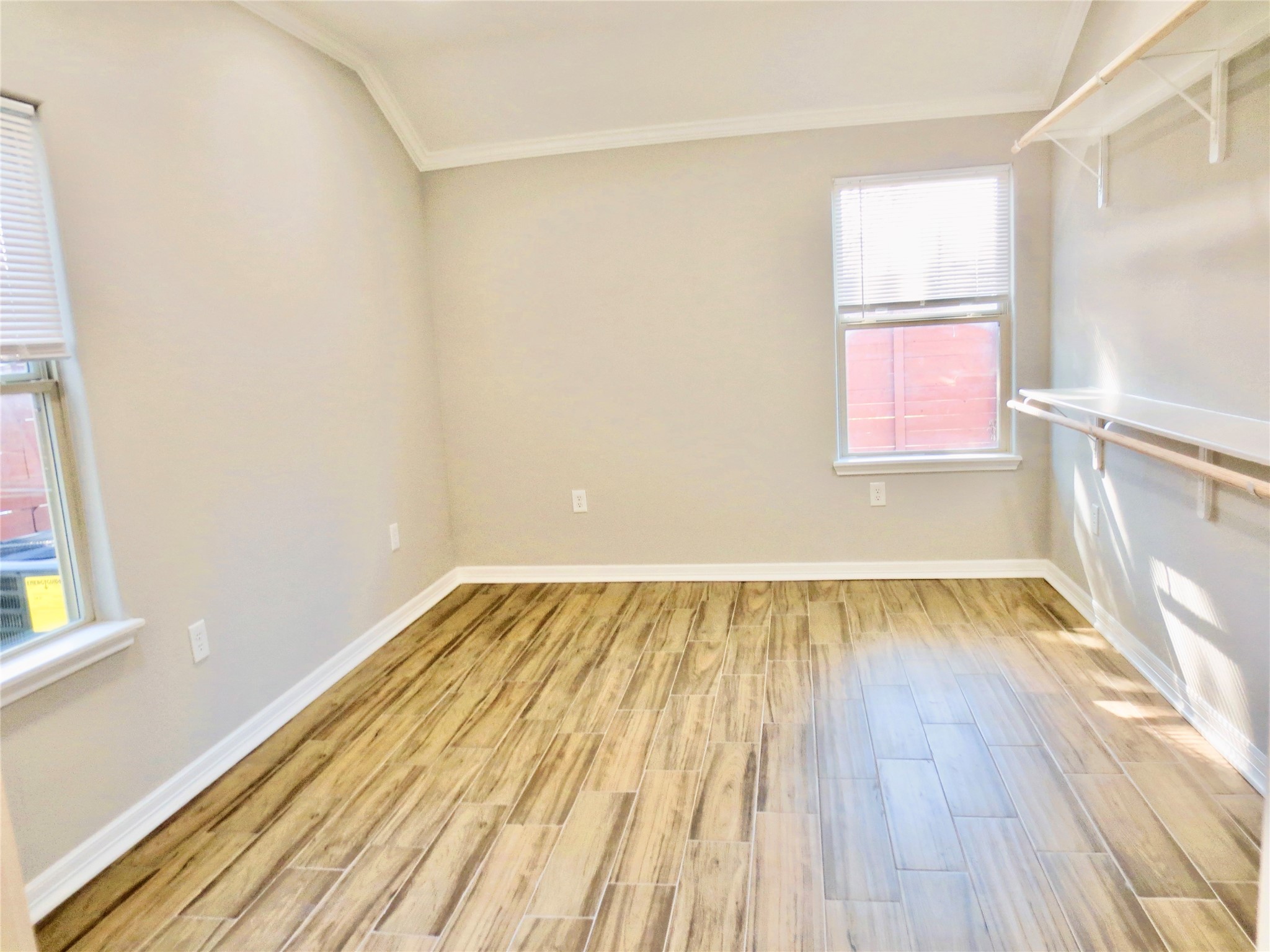 10316 Aldine Westfield Road Houston, TX 77093 - Photo 7 of 13 a view of a room with wooden floor and small window