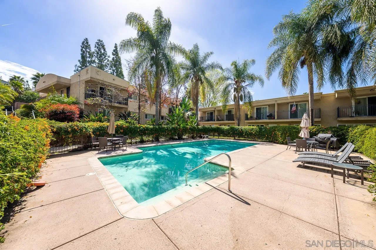9860 Dale Avenue, Unit C3 Spring Valley, CA 91977 - Photo 20 of 26 a palm tree sitting in front of a house with a patio