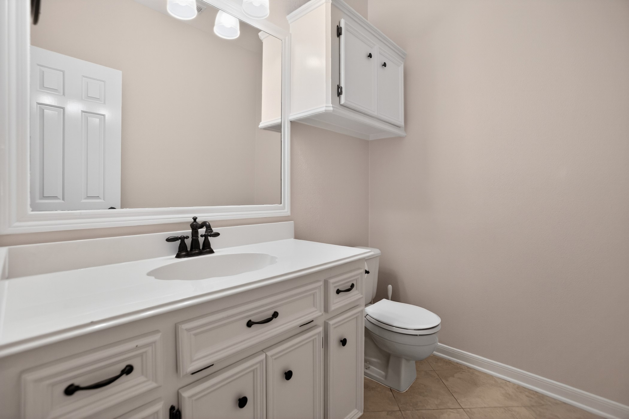 47 North Buck Ridge The Woodlands, TX 77381 - Photo 16 of 37 Convenient First-Floor Half Bath — Perfect for Guests