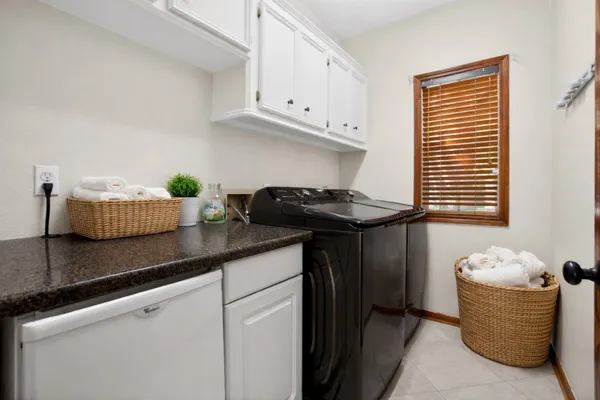 a bathroom with a sink vanity and a mirror