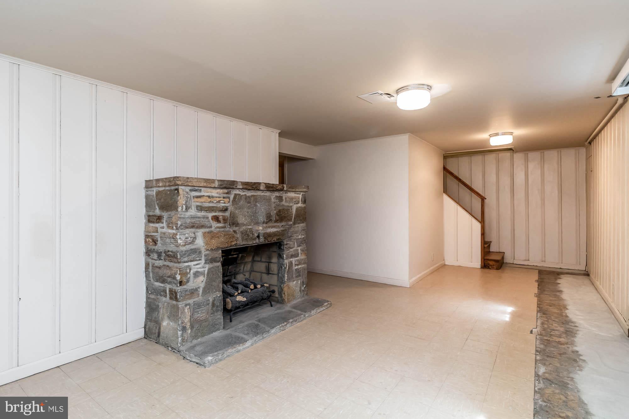 911 Weatherbee Road Baltimore, MD 21286 - Photo 25 of 34 Lowr level with stone fireplace is easily enlarged