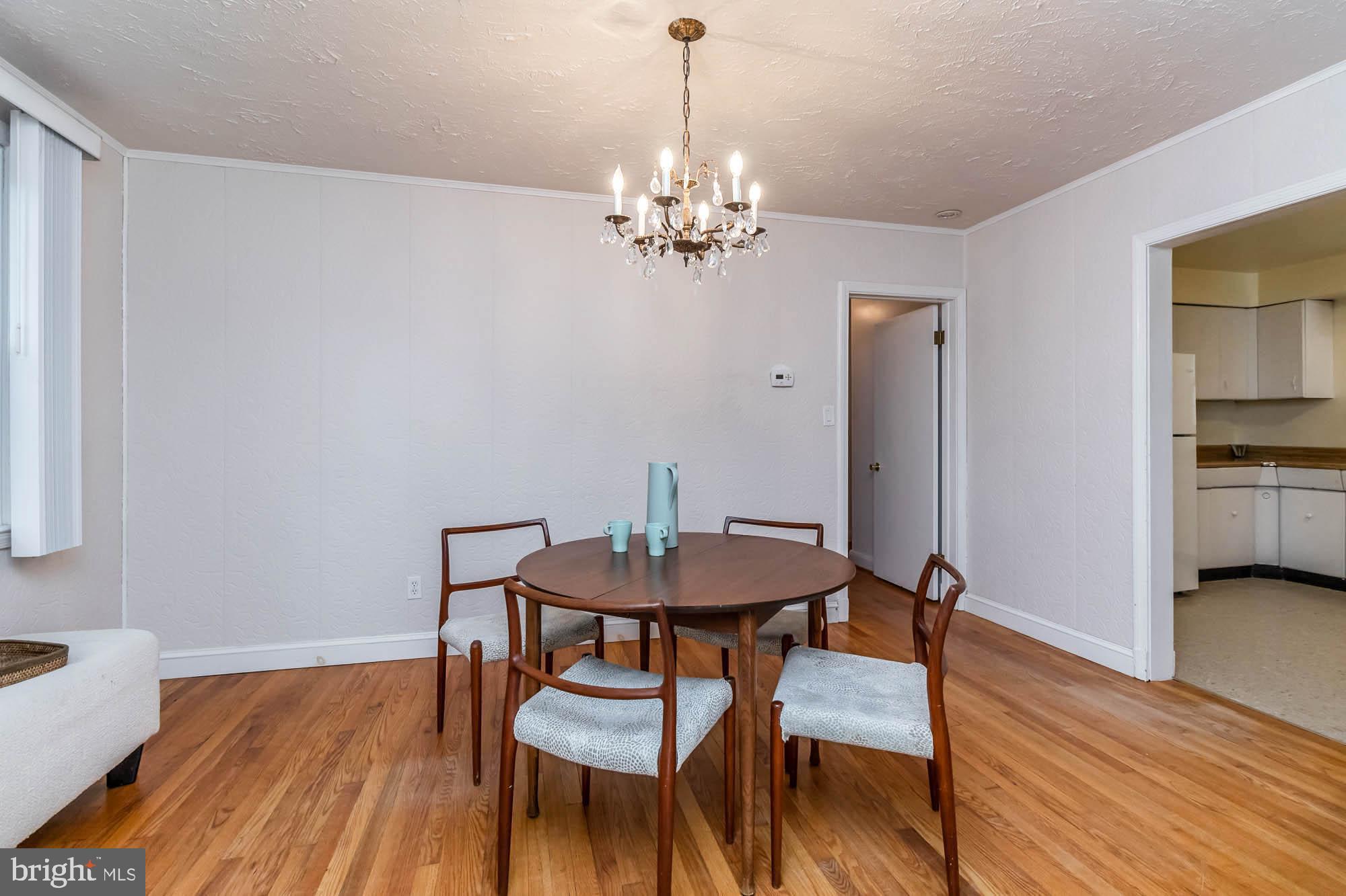 911 Weatherbee Road Baltimore, MD 21286 - Photo 8 of 34 DR opens to kitchen and LR