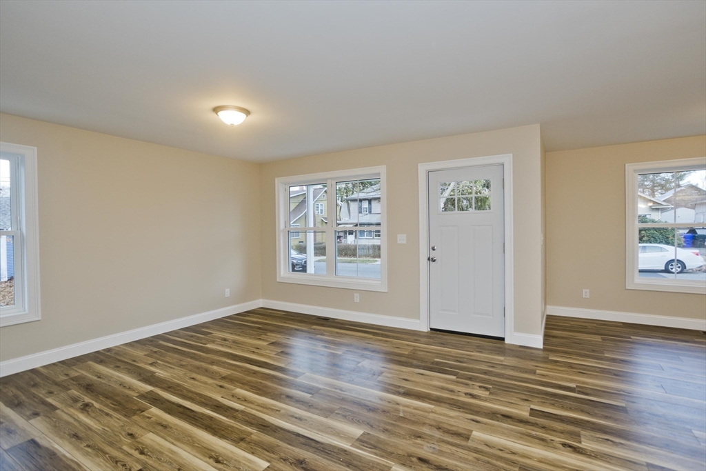 40 Preston Street Springfield, MA 01109 - Photo 12 of 32 a view of empty room with wooden floor and fan