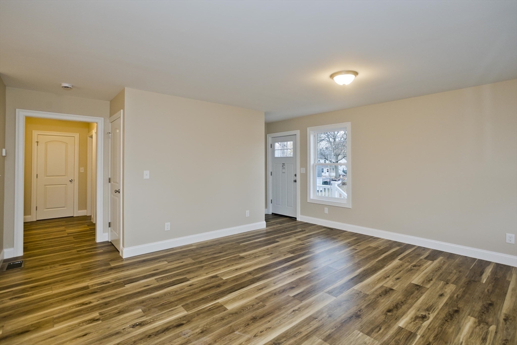 40 Preston Street Springfield, MA 01109 - Photo 13 of 32 a view of an empty room with wooden floor and a window