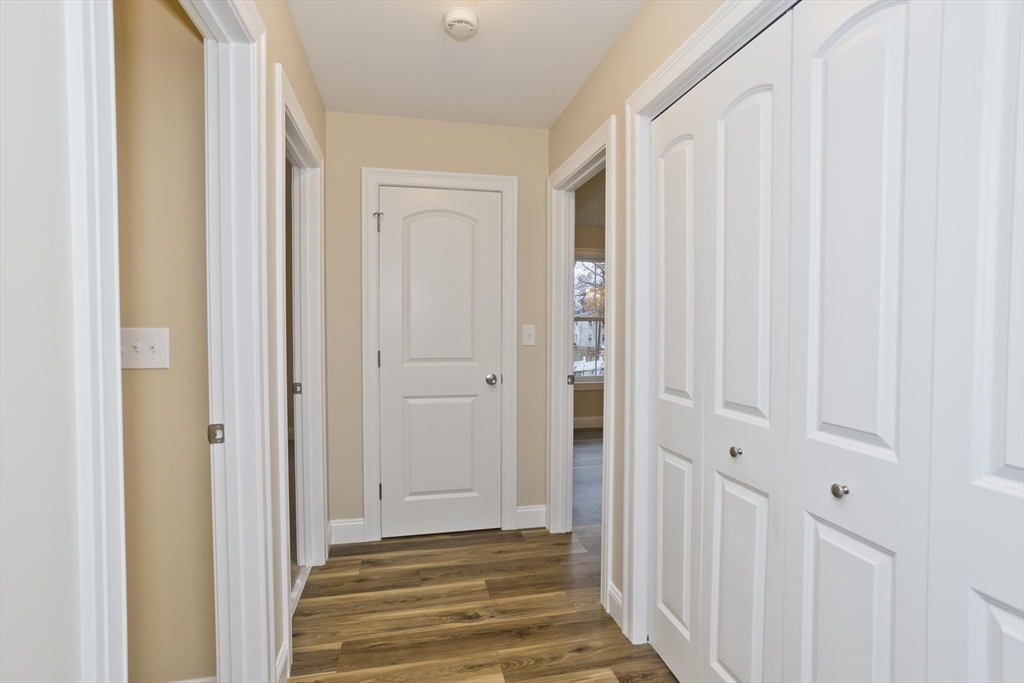 40 Preston Street Springfield, MA 01109 - Photo 15 of 32 a view of a hallway with wooden floor