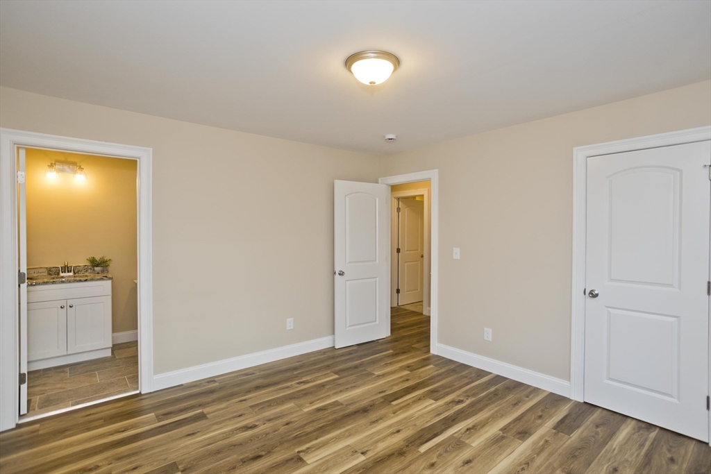 40 Preston Street Springfield, MA 01109 - Photo 17 of 32 a view of an empty room with wooden floor and a window