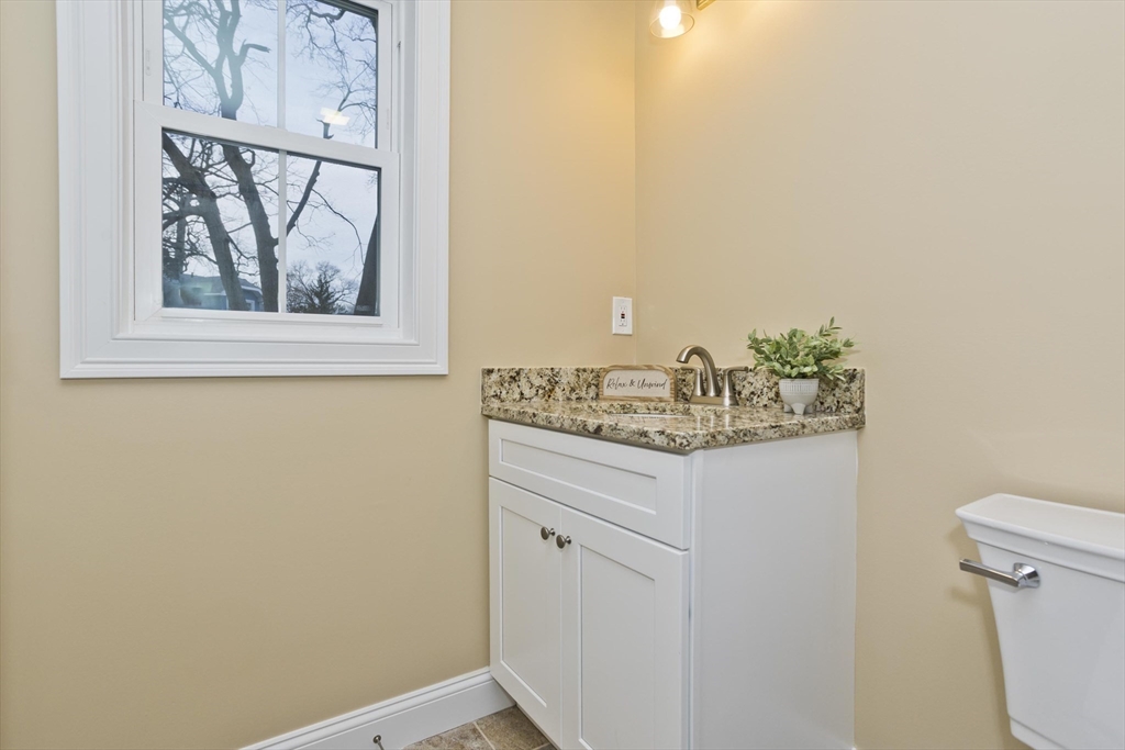 40 Preston Street Springfield, MA 01109 - Photo 20 of 32 a bathroom with a granite countertop sink and a window