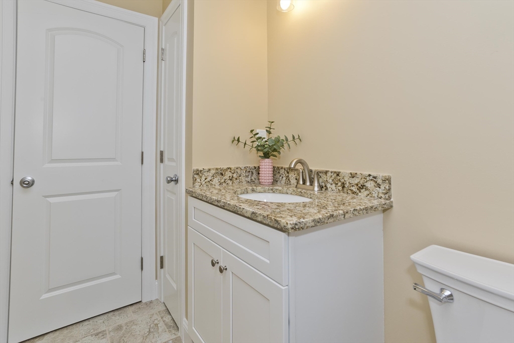 40 Preston Street Springfield, MA 01109 - Photo 27 of 32 a bathroom with a granite countertop sink and a mirror